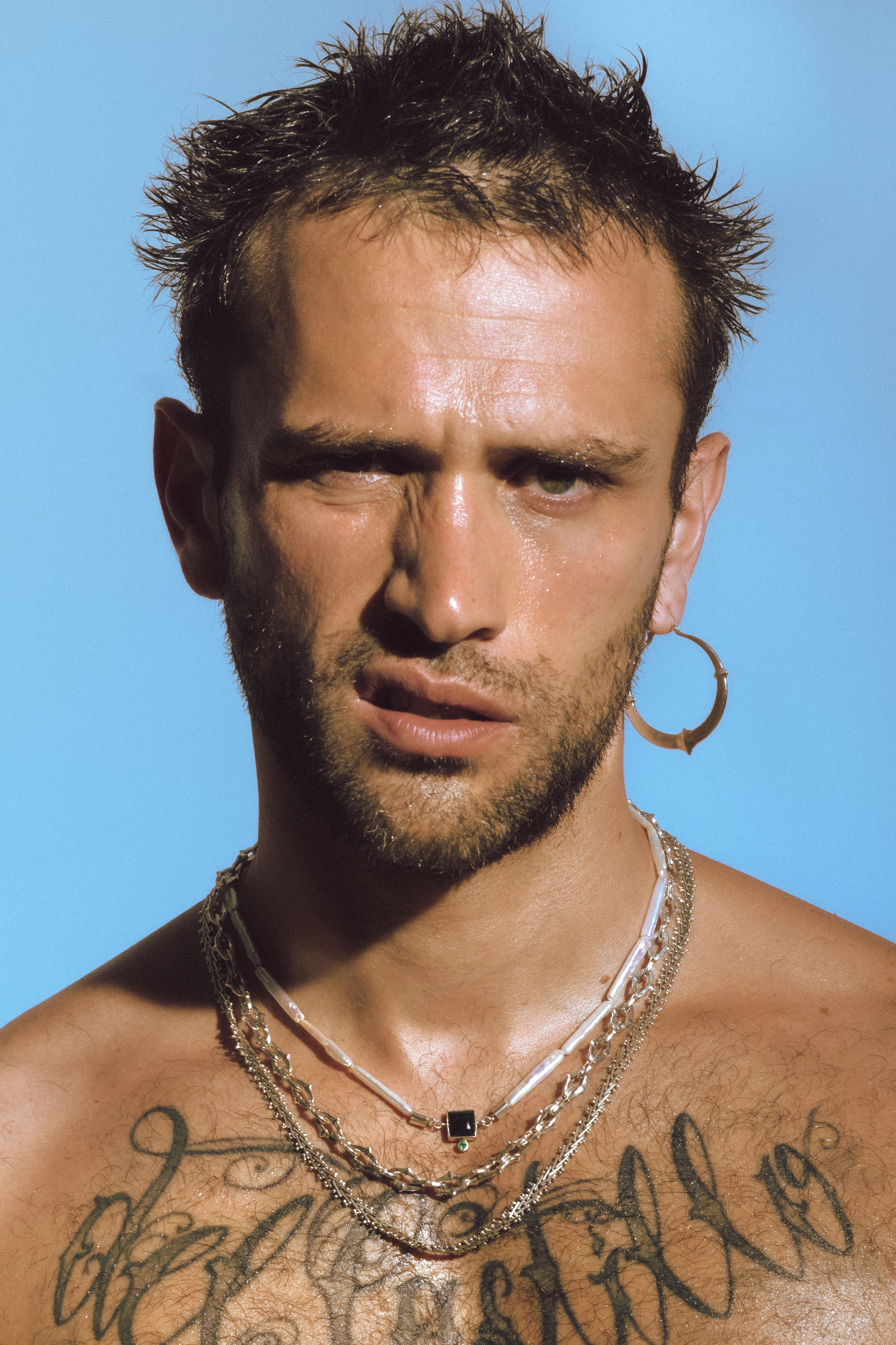 Model wearing jewelry from the ORIGIN collection.
