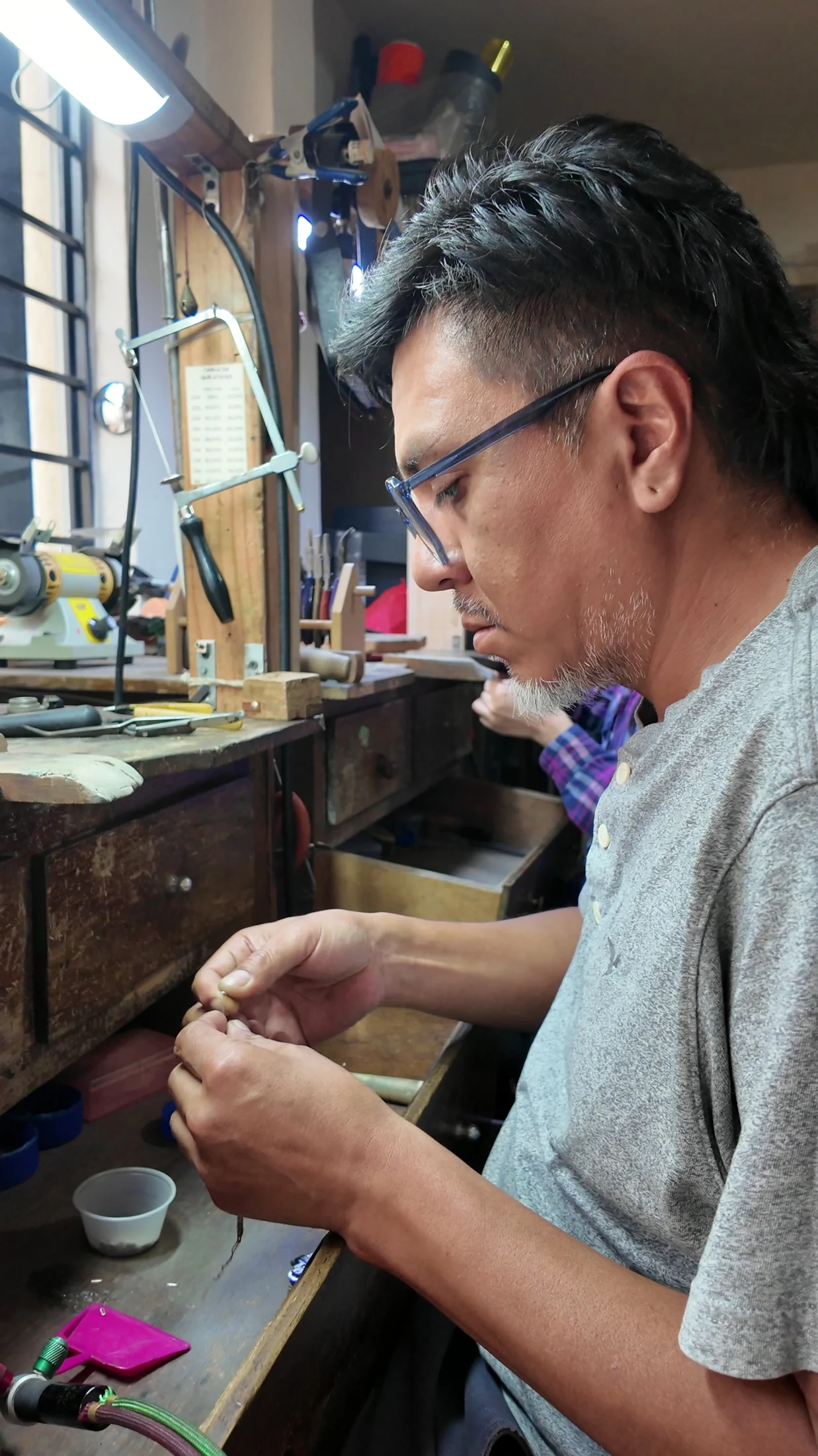 Jorge working on a jewellery component in the workshop.