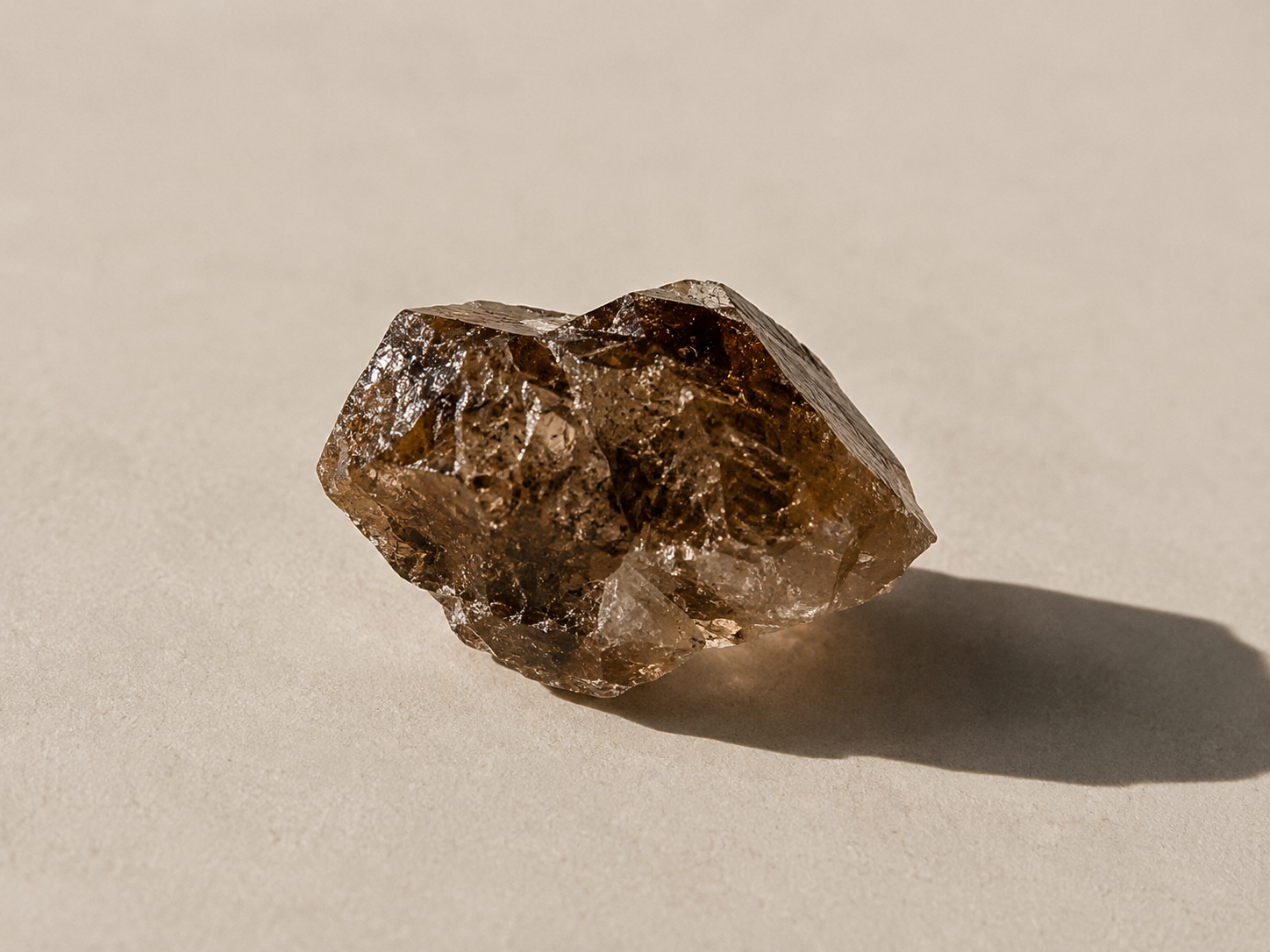 A raw gemstone specimen in warm light