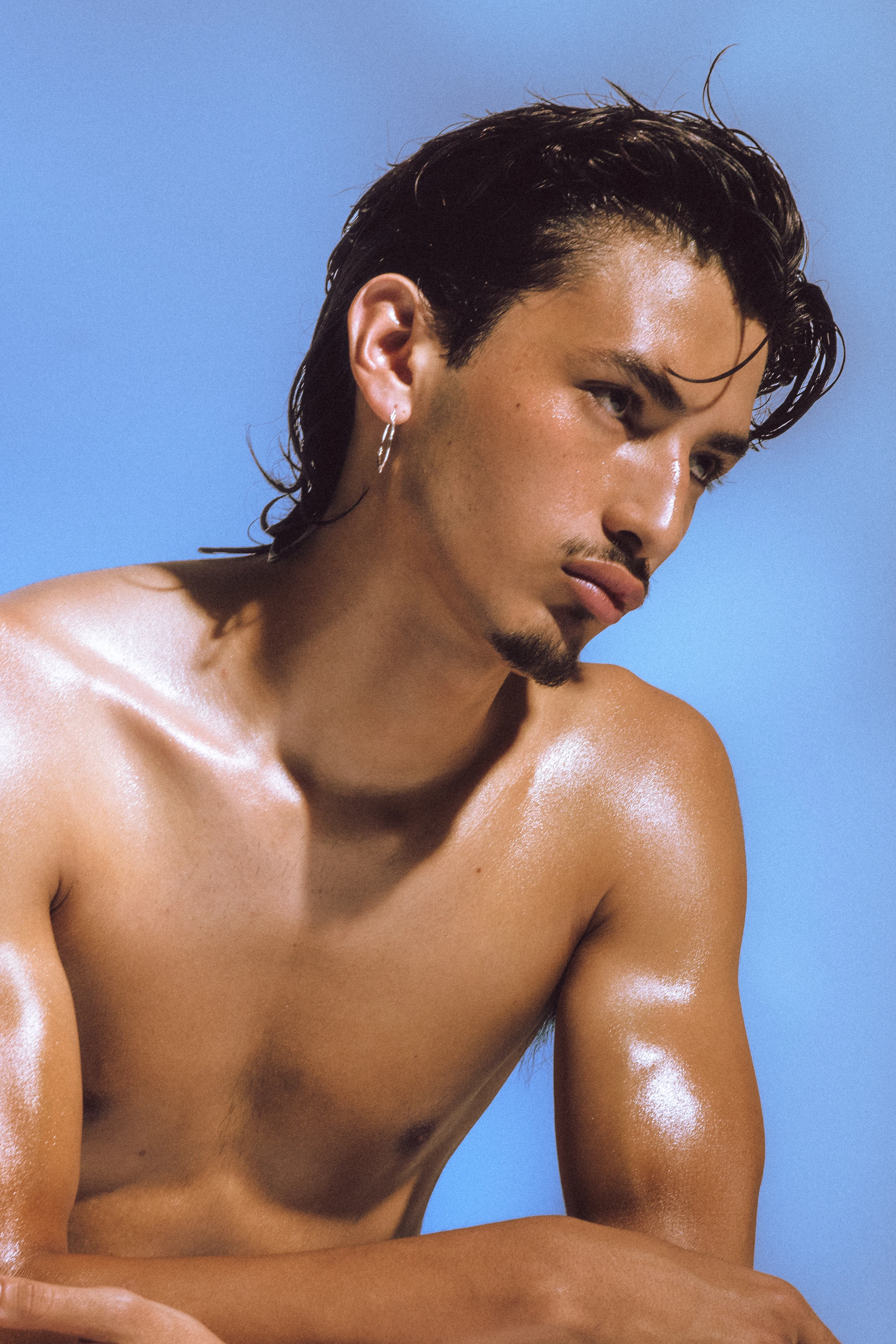 Model wearing jewelry from the ORIGIN collection.