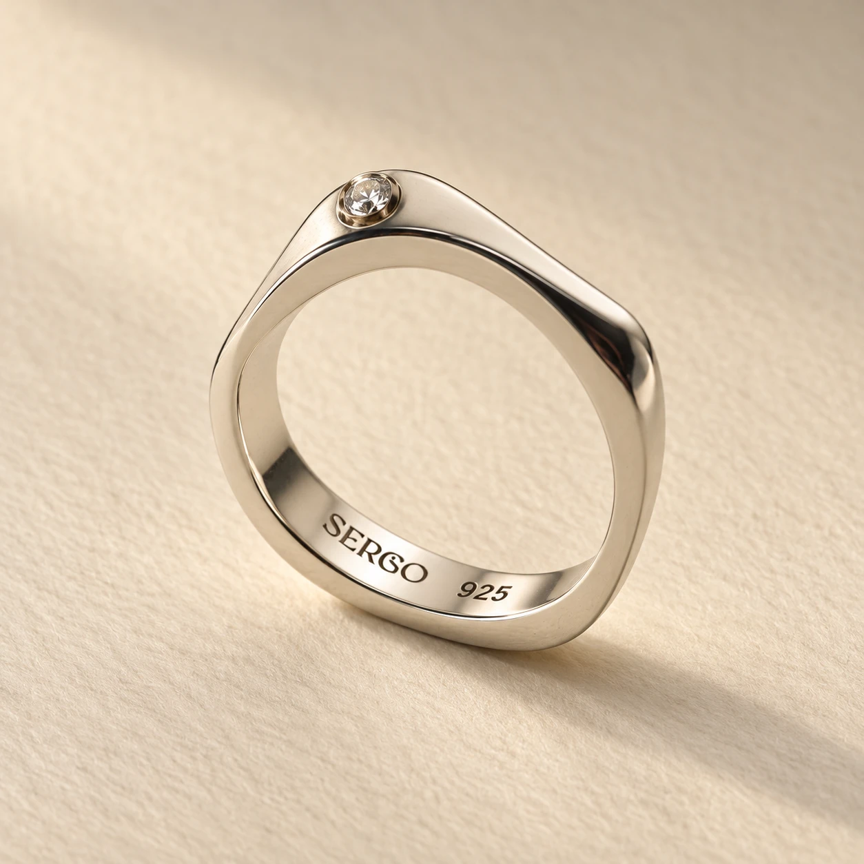 AION RING in sterling silver with a white diamond — studio mockup